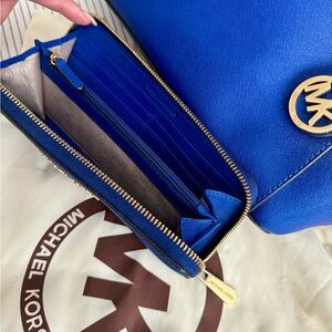 Michael Kors bag and wallet with dust bag. Color is a bright blue